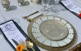 we love the intricate chargers, blue linens and pop of orange